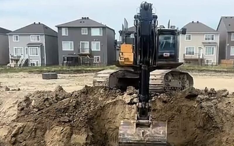 Excavation beside new homes