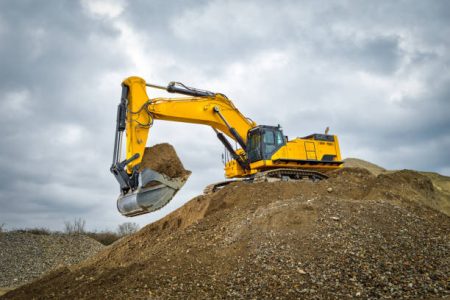 Excavator blue sky heavy machine construction site